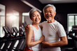 © YuTphotograph - Smiling active elderly couple in the gym. Healthy lifestyle. Happy old age