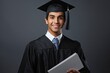 A successful young man wearing a graduation cap and gown, holding a diploma with a cheerful smile and celebrating his academic achievements.
