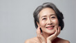 © UP - Portrait of a beautiful Asian woman with gray hair. Generative AI