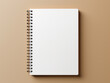 quaderno a spirale di cartone con materiale riciclato,  mockup di agenda vista dall'alto su sfondo beige 