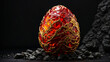 A red and gold dragon egg against a black background.