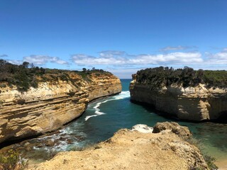 Beautiful view of cliffs and sea against the background of blue sky. Great Ocean Road, Australia.