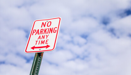 No Parking sign against an urban backdrop, a symbol of restricted access and order in the city