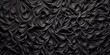 An Abstract textured embossed dark pattern. Wavy pattern with black colors