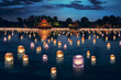 Lanterns float on the lake at night