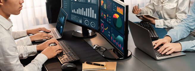 Poster - analyst working on data analysis or bi dashboard on computer monitor. business team analyzing financ
