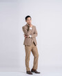 © STOCK88PHOTOGRAPHER - fullbody of a successful businessman posing on a white background