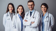 Doctor and his team smiling isolated on a white background.