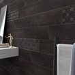 A black-patterned bathroom wall features a square mirror, a wooden toy as a décor piece, and a white towel on the floor. 3D Rendering