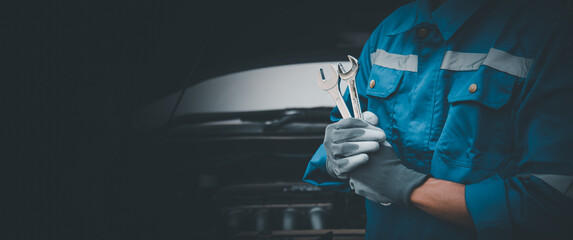 Car care maintenance and servicing, Hand technician auto mechanic using the wrench to fix car or repairing change spare part engine problem and insurance service support the range of car check.