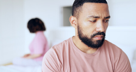 Wall Mural - Face, divorce and breakup with a man on the bed in his home after fighting with his wife as a couple. Thinking, sad or conflict with a husband in the bedroom of an apartment looking depressed