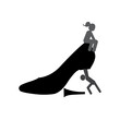 Silhouette of a man holding a shoe with a broken heel, and silhouette of a woman sitting on it