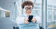 © Azeemud/peopleimages.com - Phone, office and business woman in wheelchair online for social media, networking and connection. Modern workplace, corporate and person with disability in corridor on smartphone for mobile app