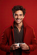 © AI_images - Happy man with cup of coffee on red background
