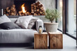 Close up of two tree stump accent coffee tables near grey sofa against window and fireplace. Minimalist loft home interior design of modern living room.