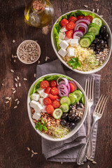 Wall Mural - Diet Greek salad with vegetables, buckwheat groats and cheese.