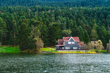 Wall Mural - Bolu Golcuk Lake and famous house view with reflections.