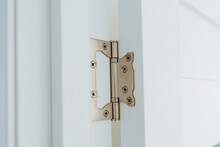 White Metal Door Peter, Steel Product, Door Opening Mechanism, Close-up Installation Of Hinge In Doorway.