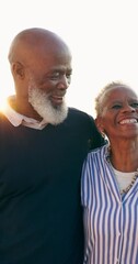 Poster - Senior, couple and talking with embrace on walk at beach for wellness, relaxing and together on vacation. Black man, woman and smile for travel, trip or holiday in retirement for romance in marriage