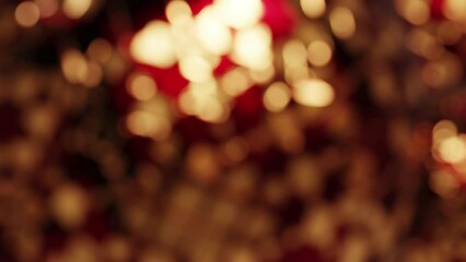 Wall Mural - Abstract Macro Christmas Red Gold Defocussed Bokeh Lights Baubles Decoration Background Loop

