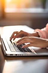 Humans hand typing on laptop keyboard. Blured morning background. Business concept image