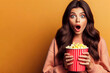 impressed shocked woman youngster open mouth speechless eating popcorn breathtaking moment watch tv. ai generative