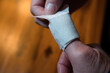 the fingertip of the thumb is bandaged