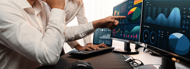 Poster - Analyst working on data analysis or BI dashboard on computer monitor. Business team analyzing financial data by Fintech in corporate office for business marketing and strategy planning. Trailblazing