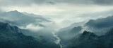 Fototapeta Góry - Misty mountains fading into the distance. foggy mountain. aerial view of mountain and river