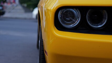 yellow car headlight close up