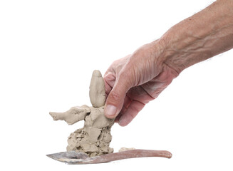 Wall Mural - Grey modelling clay shaped in dirty clay hands isolated on white, clipping 
