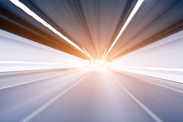 Motion blur shot of an empty road under a tunnel with white lights