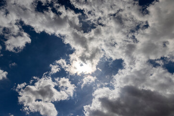 sunny weather with white clouds on a blue sky background