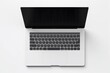 © DreamWeaver - a high-end laptop from a top view on a clean white background. Leave space on the screen for adding custom graphics or text.