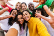 © Xavier Lorenzo - Multiracial young group of women having fun together taking selfie portrait. Joyful millennial teenage girls enjoying time together at city street. Female community and friendship concept.