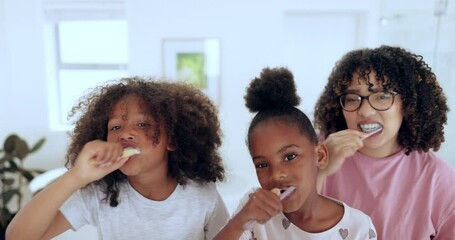 Poster - Mother, children and brushing teeth for dental hygiene, health and bonding in bathroom in portrait. Happy family, face and cleaning mouth for protection, care and love for morning routine at home