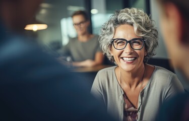 Wall Mural - woman laughing smiling while having business meeting. 