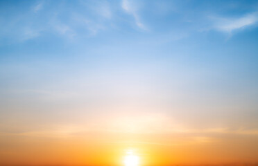 real amazing beautiful sunrise and luxury soft gradient orange gold clouds with sunlight on the blue