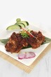 © Stora Space - delicious Grilled Ribs called Iga Bakar Madu in Indonesian isolated on a white background
