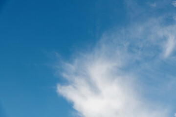 Wall Mural - wispy clouds in the blue sky