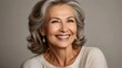 © Roselita - Beautiful caucasian woman with smooth healthy face skin. Gorgeous aging mature woman with long gray hair and happy smiling. Beauty and cosmetics skincare advertising concept