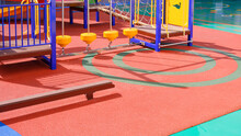 Playground Climbing Equipment With Balance Beams On Colorful Rubber Floor In Outdoors Playground Area At Kindergarten School
