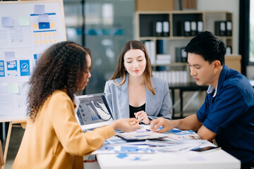 Wall Mural -  Team business people meeting in office. Employee brainstorm and work plan and discuss project by point on paper and tablet. .