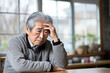 © Iryna - Elderly Korean man suffering from headache