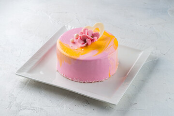 Sticker - Pink mousse cake decorated with flowers and chocolate heart in a plate.