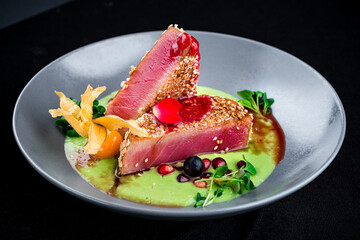 Sticker - Seared tuna with sesame, physalis, cranberry, pomegranate, sauce and microgreens, lunch.