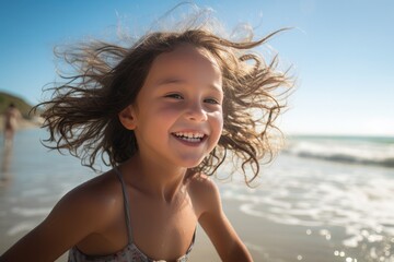 A cheerful and happy little girl enjoys a carefree summer day on the beach, radiating childlike joy and laughter.