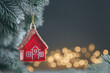 © iloli - Christmas tree toy in the form of a red house on the Christmas tree