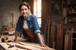 carpenter woman working in wood shop