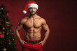 sexy muscular young man dressed as Santa